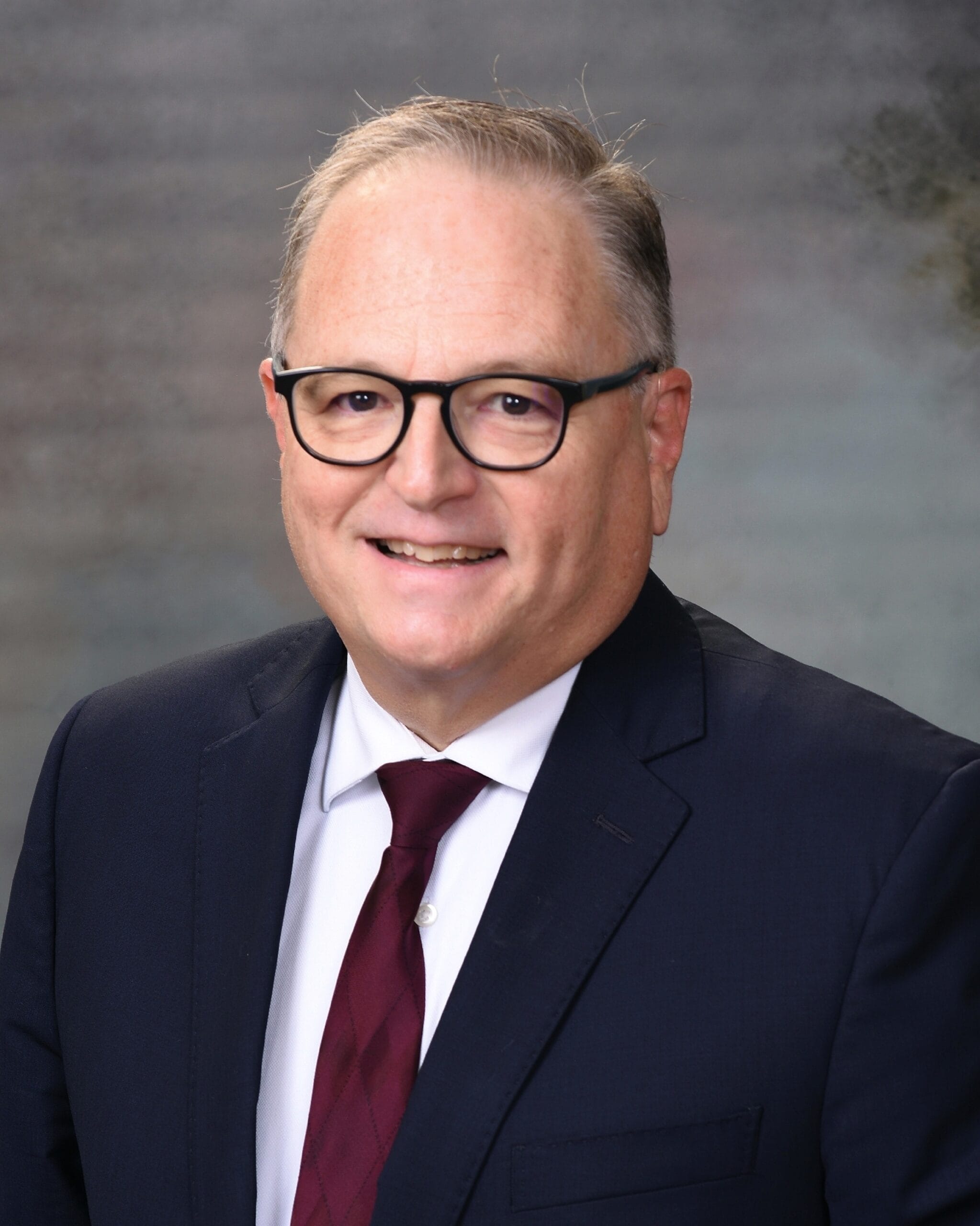 portrait photography of man wearing black suit jacket