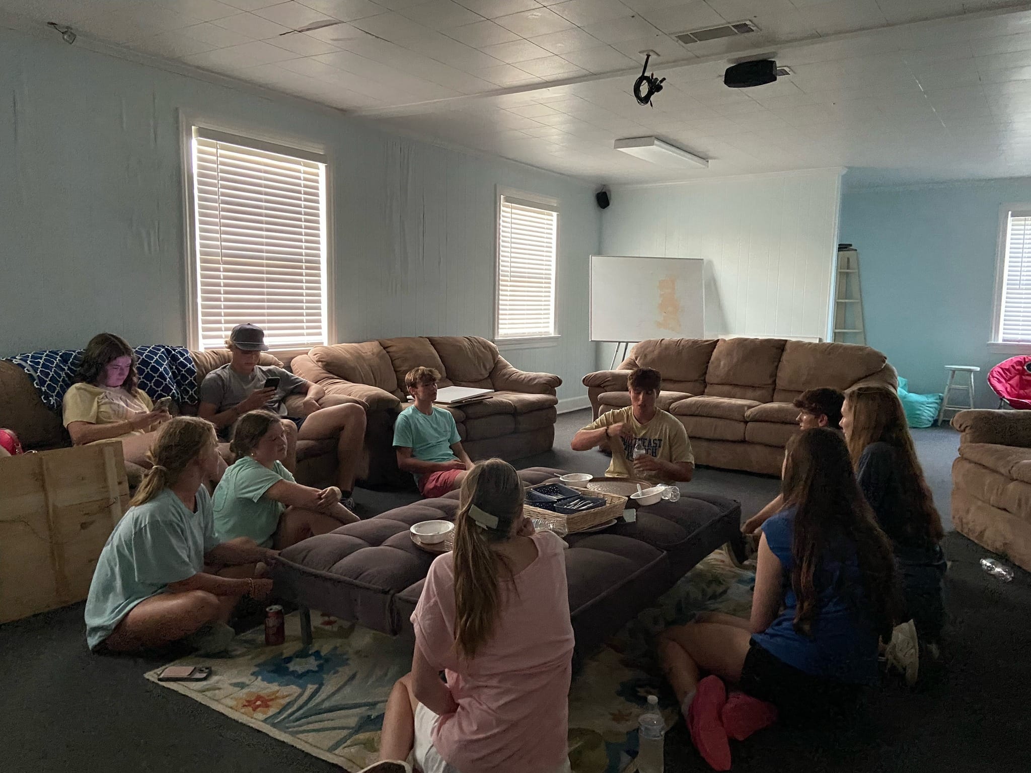 a child is drawing on a piece of paper