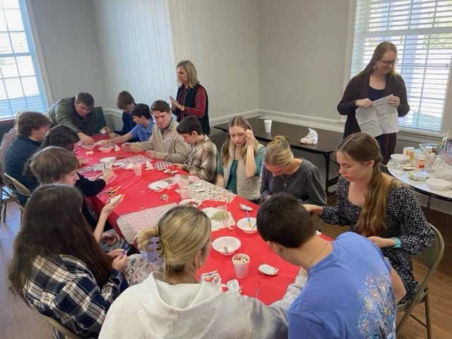 a child is drawing on a piece of paper