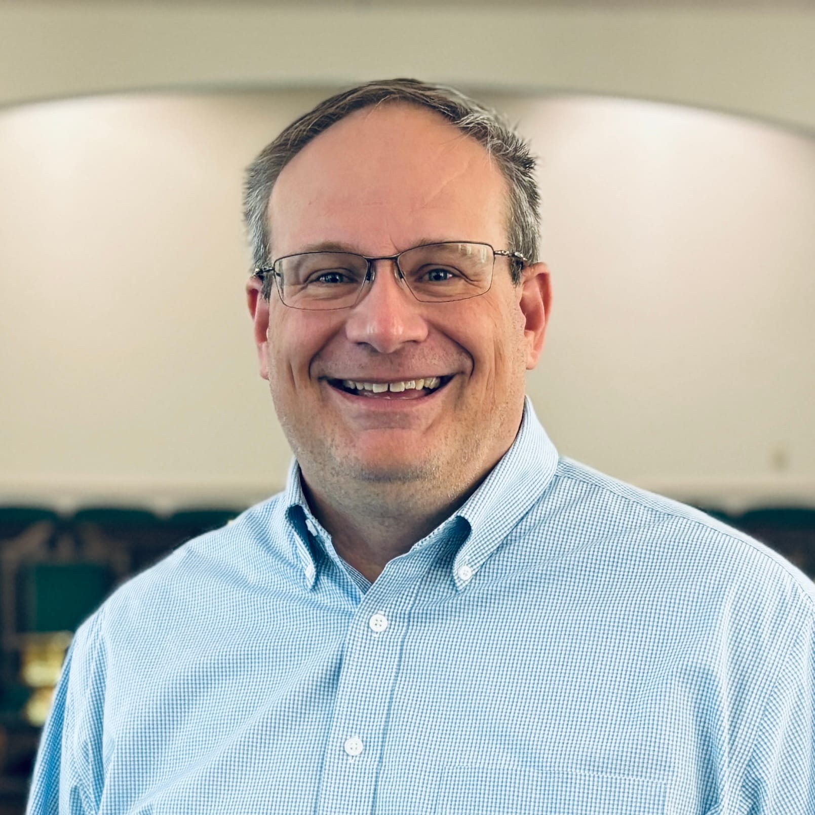 Kirk Hagen a man wearing a hat and glasses