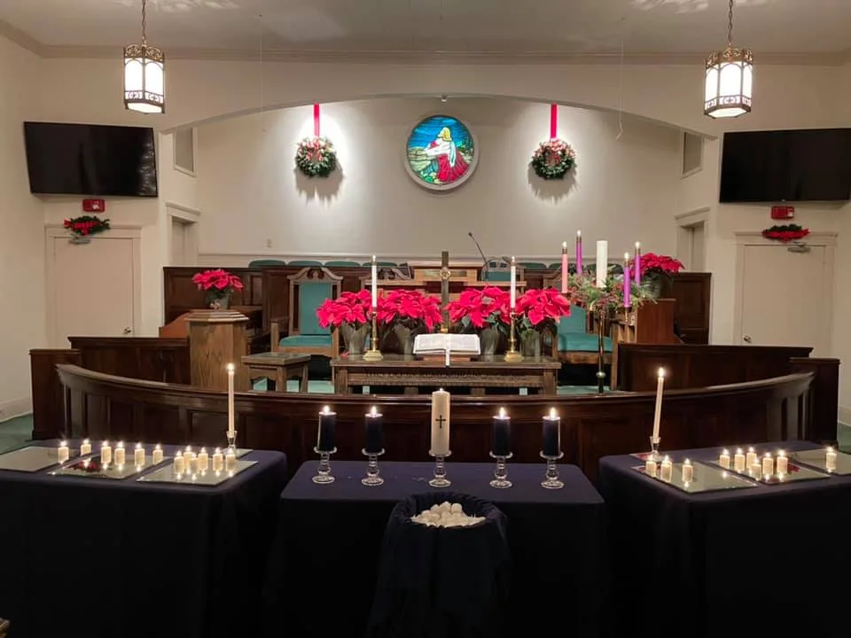 Christmas Eve in Brooklet person raising hand