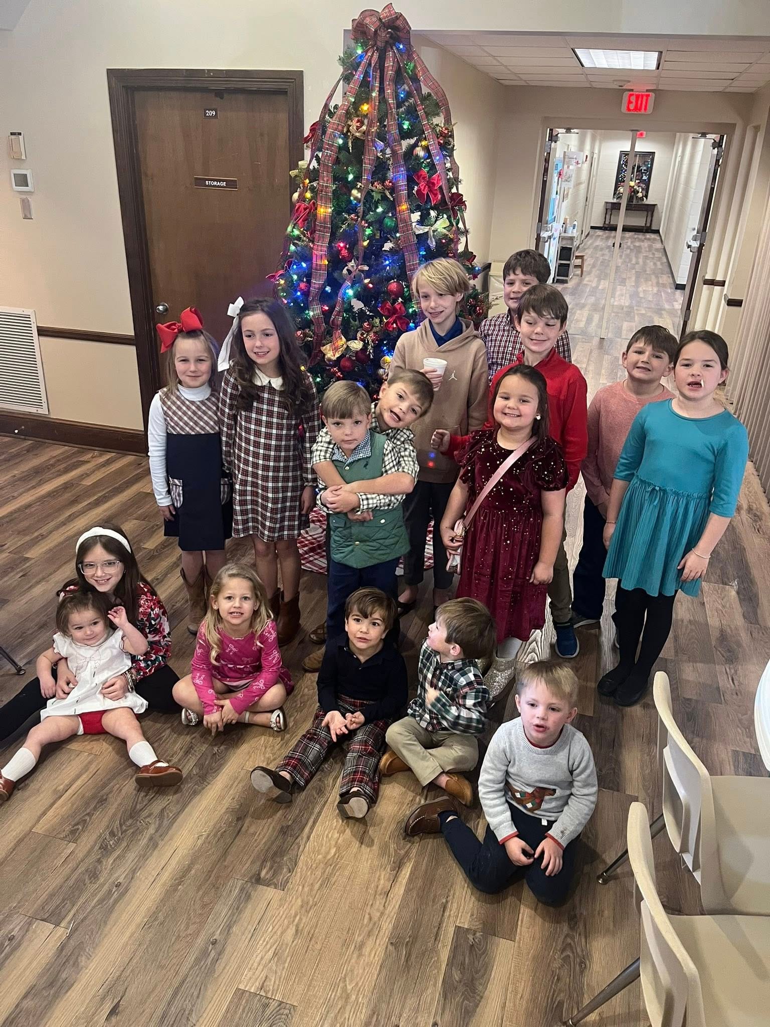 Kids Ministry at Brooklet people sitting on chair in front of table while holding pens during daytime